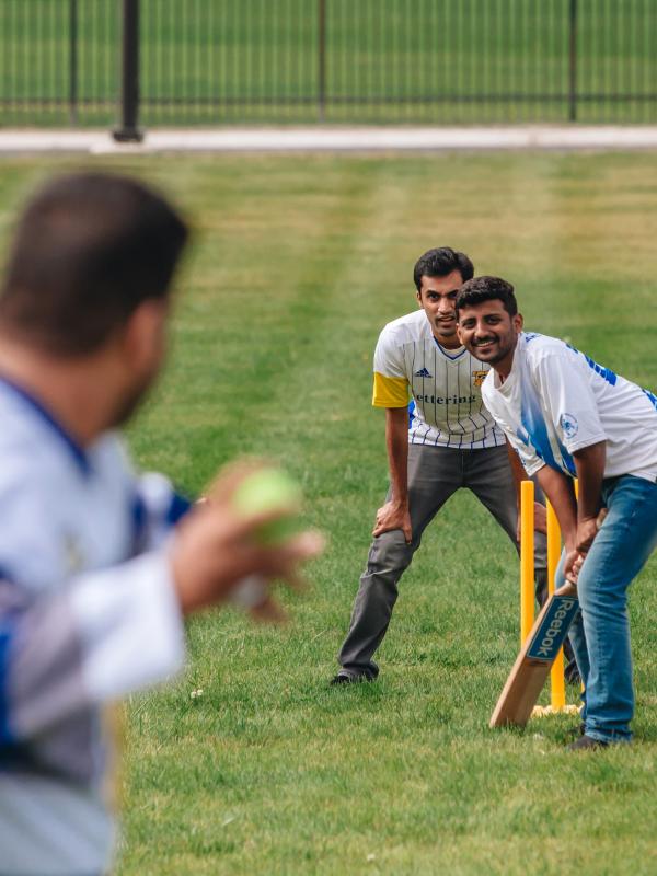 Graduate students play cricket
