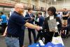 Student shaking employers hand at the employment fair